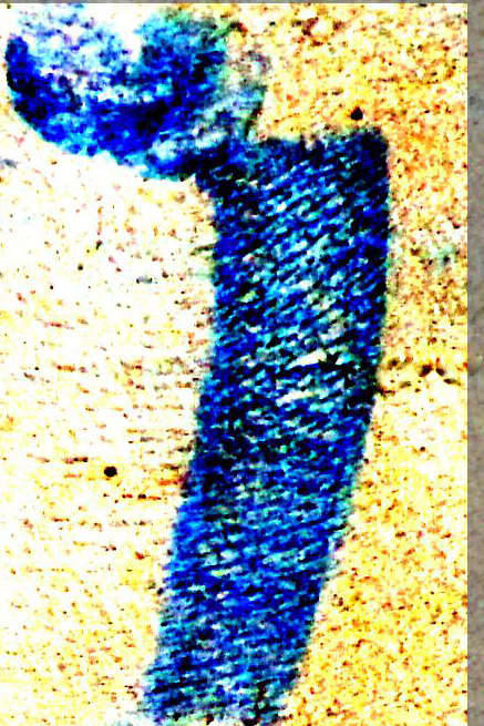 Faceless grief figure scratched into the mahogany